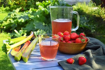 Fresh strawberry and rhubarb compote on a table in the garden
