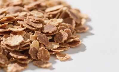 Obraz premium Flakes brown color dry texture food item close-up white background breakfast cereal grain product
