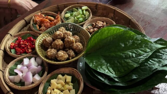 Savoury Leaf Wraps, Miang kham, thai appetizer food. 4k video footage
