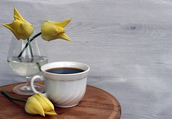 A cup of coffee will lift your spirits in a free moment, and tulips will make you smile