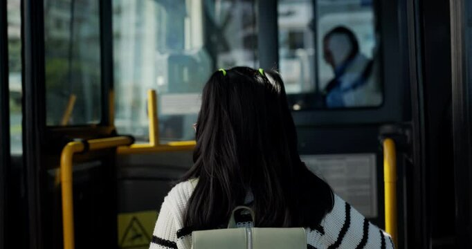 Leaving, child and hug for mom, bus and journey with public transport to school, good bye and smile. Commuting, woman and embrace for daughter in city, family and parent on first day of elementary