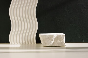 White stone pedestal, product presentation podium, template, black background, sunlight shadow. Abstract minimalist concept, empty podium display product, showcase for cosmetic products . Copy space