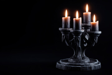 Fototapeta premium Candlelit display creates a mystical atmosphere in darkened space