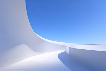 A smooth, white architectural space curves elegantly into a clear blue sky