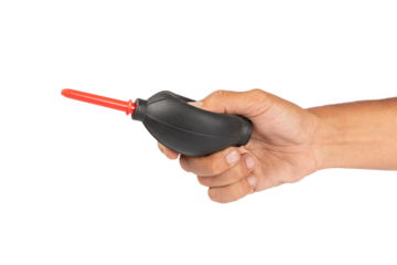 Male hand holding a camera lens blower isolated no background cutout