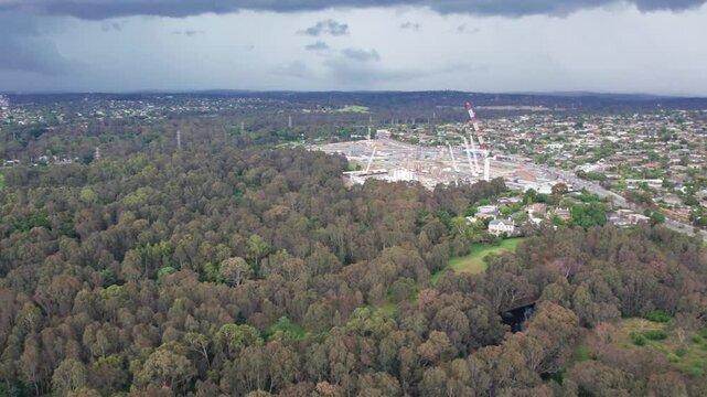 Panning aerial view of Blleen Road from Manningham Road to the Eastern Freeway during construction of the North East Link project in December 2023, Victoria, Australia.