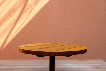 wooden tabletop with warm wall background. perfect for product display amd mockup