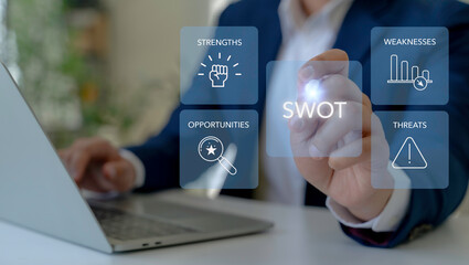 SWOT Analysis Concept. A businessman interacts with a virtual SWOT analysis interface,  the...