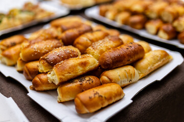Assorted baked goods displayed on a platter at a festive gathering during the afternoon