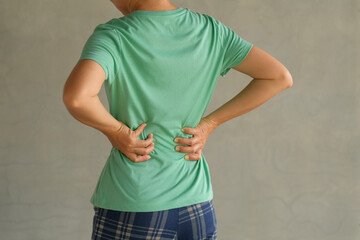 Woman suffering from back pain, have a backache, health problems, human pain concept.