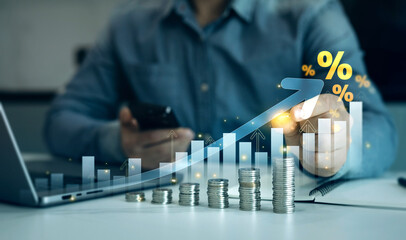 Person is calculating income and return in percent.Percentage interest rates continue to increase,...