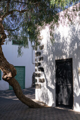 Beautiful old European street with summer shadows on the buildings. 