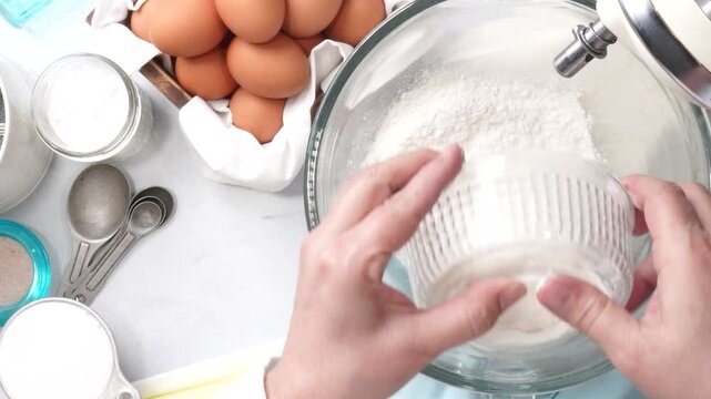 Baking a triple layer light blue cake with buttercream icing.  Decorating a vanilla cake for spring time.  Icing a cake and using coconut and candy eggs to make it look like a robin egg.
