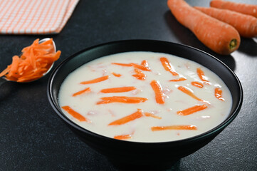 Carrot raita served in a bowl.