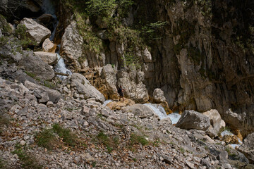 Waterfall cascading through rocky ravine