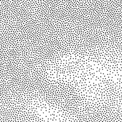 A densely packed of small evenly spaced black dots against a white background.