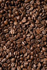Close-up of glossy roasted coffee beans with high contrast. Perfect for cafe visuals, product labels, ads, or background textures