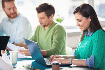 Fototapeta premium Young software developers in coworking open space