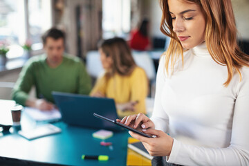 Young software developers at work using technology