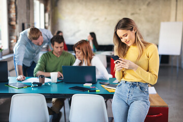 Young software developers at work using technology