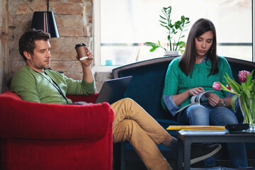 Young software developers in coworking open space taking a break