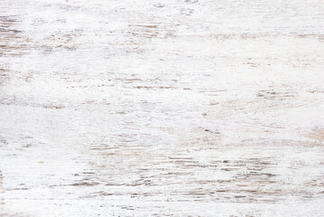 Grunge background. Texture of an old white shabby wooden table.