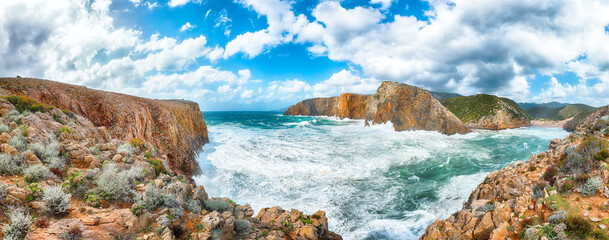 Attractive view of cliffs in valley Cala Domestica  and storm on the sea