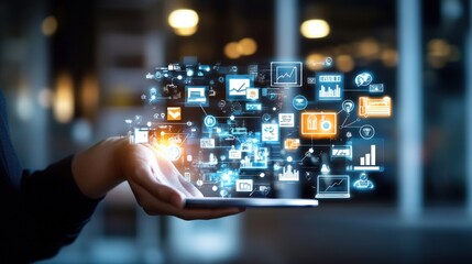 Hand holding a digital tablet with holographic technology icons displaying data analysis and business applications for visualization online service.