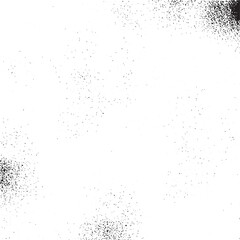 Obraz premium A textured white background displays scattered dark particles creating a dynamic abstract effect.