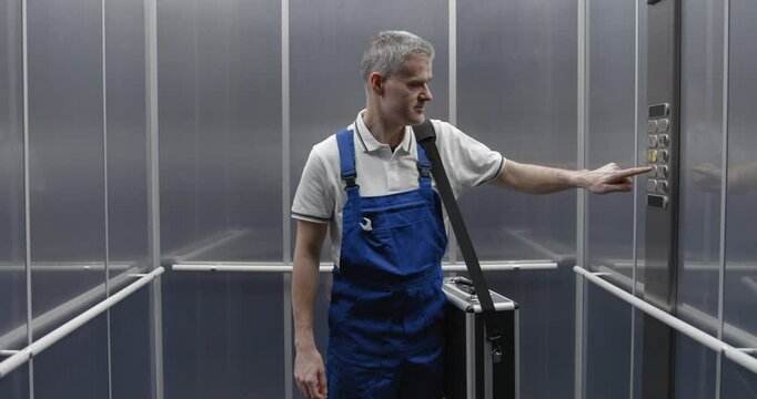 Professional repairman taking a lift