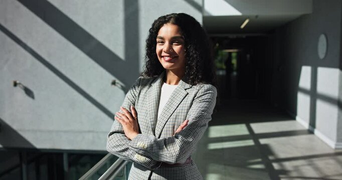 Happy, crossed arms and face of businesswoman in office with confidence for finance career. Smile, professional and portrait of female financial manager with pride for corporate company investment.