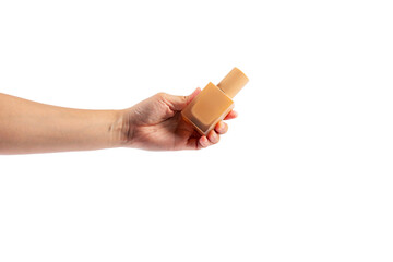Cosmetic cream tube in womans hand on transparent background