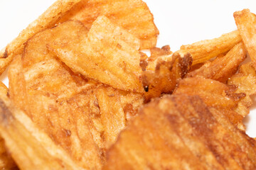 Close up of fresh crinkle cut seasoned crisps snack