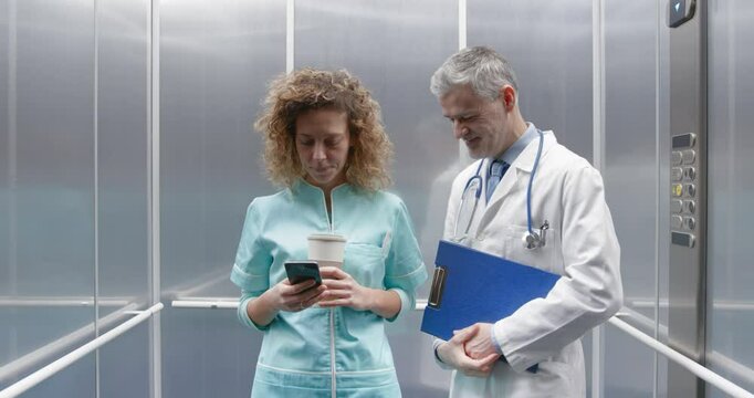 Rude intrusive doctor flirting with a nurse