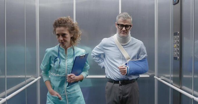 Cheerful man faking an injury and deceiving an insurance company