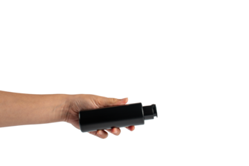 Black cosmetic flip top bottle in hand isolated on transparent background.