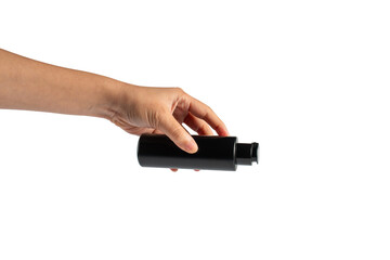 Black cosmetic flip top bottle in hand isolated on transparent background.