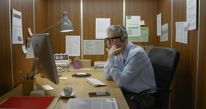 Tired employee falling asleep at his desk