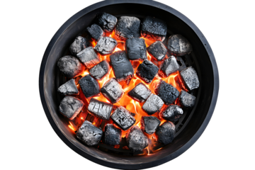 Charcoal briquettes burning in a round grill.  Bright orange flames erupt from glowing, dark gray charcoal cubes