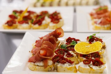 Delightful selection of gourmet appetizers arranged elegantly for a festive gathering in a bright venue