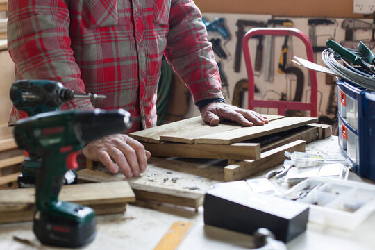 Man working on a project at a men's shed