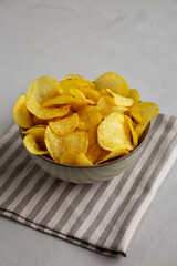 Homemade Kettle Cooked Potato Chips with Salt in a Bowl, side view.