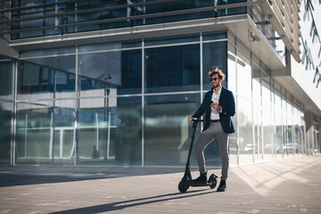 Businessman on e scooter in the city