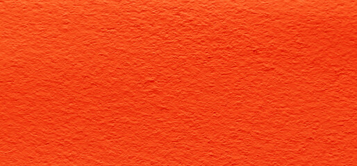 Fototapeta premium Surface of abstract concrete cement texture in autumn leaves color. Color of orange concrete wall background. 