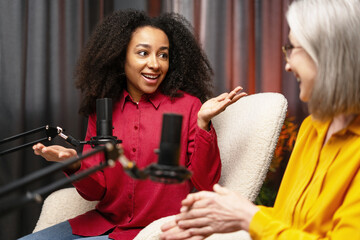 Two podcasters recording a new episode in a studio