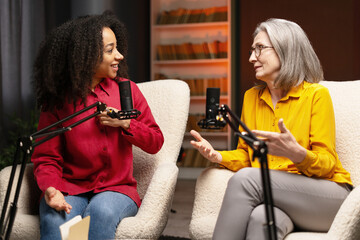 Two women recording a podcast in a studio