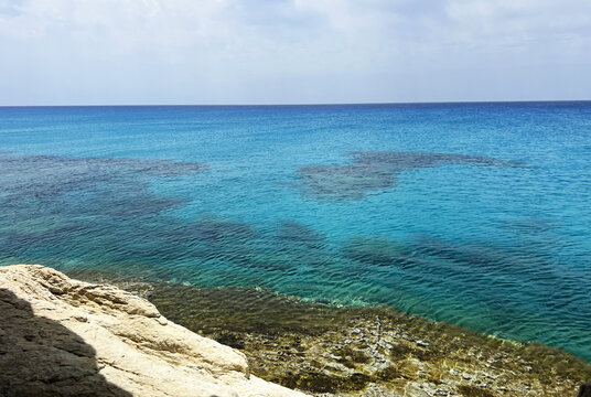 Serene mediterranean sea view with turquoise waters and rocky shoreline in cyprus - Powered by Adobe