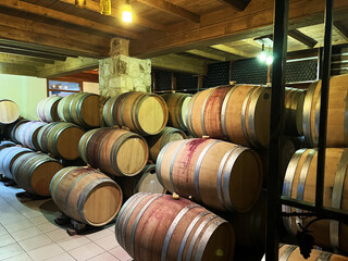 Rustic wine cellar in cyprus with wooden barrels for authentic vineyard experience and tasting tours