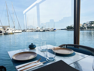 Scenic dining experience at waterfront restaurant overlooking cyprus marina for summer leisure