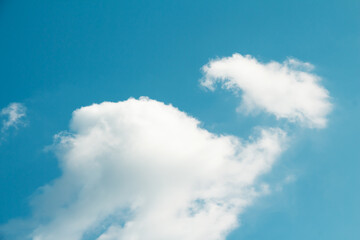 White cloud in bright blue sky. Natural picturesque background